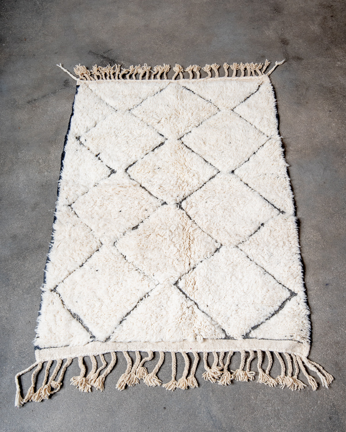 Modern, designer, handcrafted Berber rug from Morocco. Beniourain carpet with minimalist design, natural wool pile and a fluffy texture.